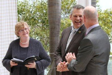 Craig & James with Jennifer Cram, gay
                    positive marriage celebrant